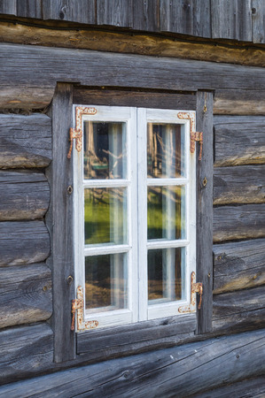 Rustic cottage window in old wooden rural houseの写真素材