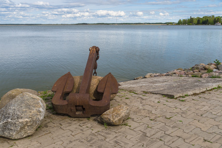 Large old rusty anchor on sea coast of Haapsalu town Estoniaの写真素材