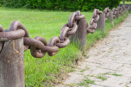 Fence from former rusty barge anchor chainの写真素材