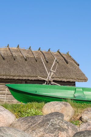 Fisherman rowboat and old rustic utility houseの写真素材