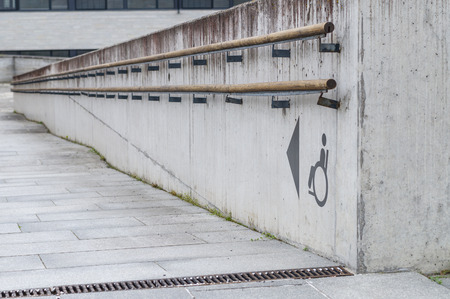 Using wheelchair ramp with physical impairment symbolの写真素材