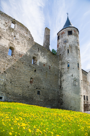 Medieval wall and tower with clock in Haapsalu town Estoniaのeditorial素材
