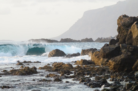 Scenic rocky Tenerife island coastline and waves of Atlantic ocean