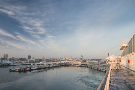 Sunrise over Tallinn sea port and old town view from cruise shipの写真素材