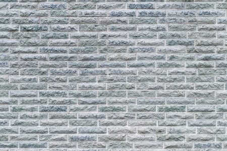 Grey stone modern brick wall backgroundの写真素材