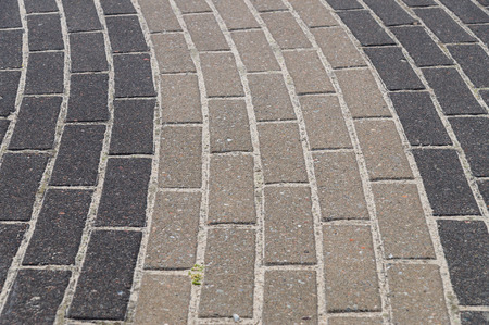Paving decorative dark and light tiles, road detail