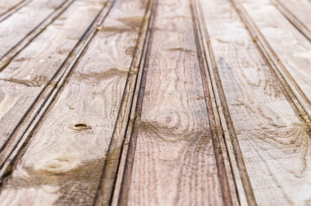 Wet wooden plank texture, blurred background with selective focusの写真素材