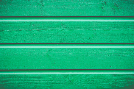 Wooden wall painted green textureの写真素材