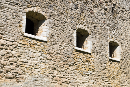 Medieval limestone wall with three windows, Padise Abbey, Estoniaのeditorial素材