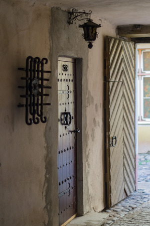Ornate door and lantern in passagewayの写真素材