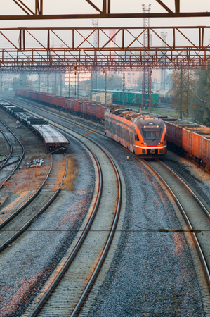 Modern electric train moving through railway stationのeditorial素材