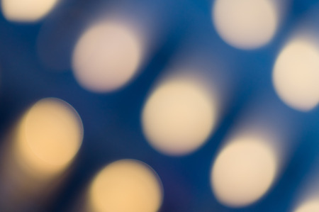 Blue background with oval soft bokeh lightsの写真素材