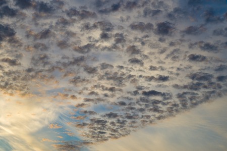 Different type of clouds on sunsrise skyの写真素材