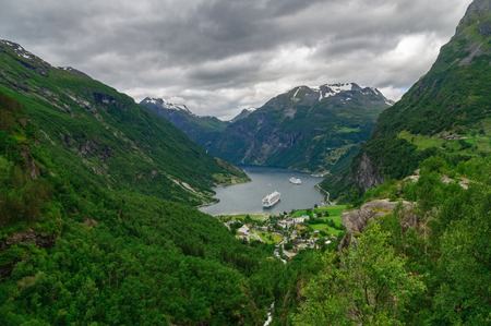 Aerial view of Geiranger village on the secluded shore of Geirangerfjord, Norwayの写真素材