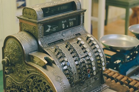 Retro style checkout machine, vintage toned imageの写真素材