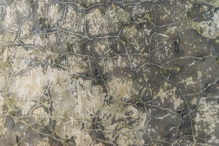 Old stone wall with many cracks, grunge backgroundの写真素材