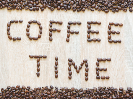 Word coffee time made from coffee beans with borders, from above viewの写真素材