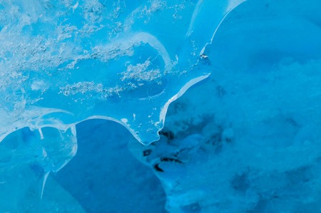 Abstract closeup on deep blue ice inside of Nigardsbreen glacier, Norway