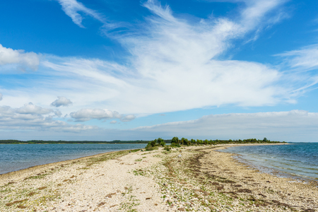 Point of the Saare rocky coastline against scenic cloudscape, Kassari island, Estoniaの写真素材