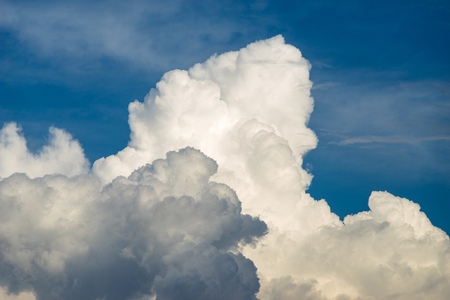 Blue sky background with scenic fluffy cloudsの写真素材