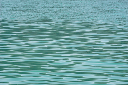 Ripple on turquoise lake water, natural backgroundの写真素材