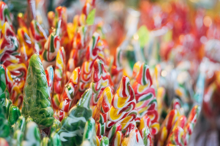 Stall with traditional colorful and festive candies at the Christmas market, selective focusの写真素材