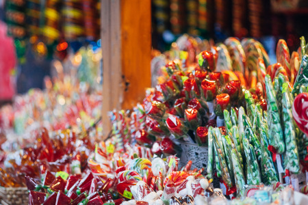 Stall with colorful and festive candies at the Christmas market, selective focusの写真素材