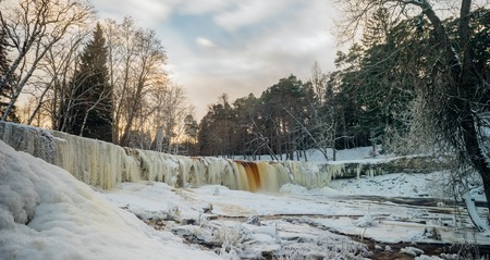 Keila-Joa waterfall by winter sunset. Long exposure panorama. Harjumaa, Estoniaの写真素材