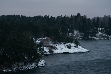 Rocky coast of  Stockholm archipelago, stormy day by winterの写真素材