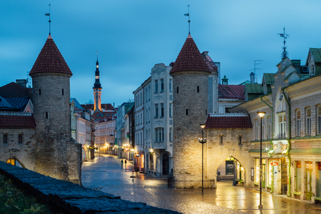 TALLINN, ESTONIA - OCTOBER 30 2016: Twilight view at Viru Gate and street, part of Old Town architecture. Two towers become a symbol of the city.のeditorial素材