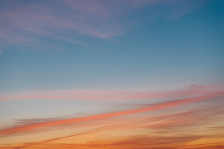 Wonderful sunset sky background with colorful cloudsの写真素材