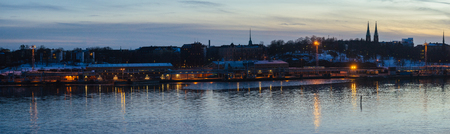 Panorama of Helsinki city harbor in twilight by wintertime, Finlandの写真素材