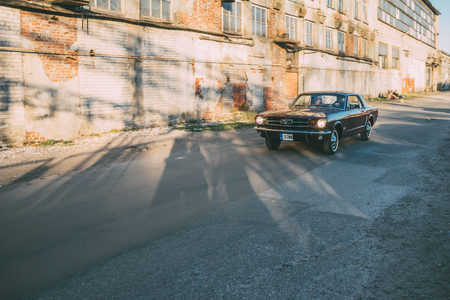 TALLINN, ESTONIA - MAY 6, 2017: American Beauty Car Show, in motion 1965 Ford Mustang on street of Kalamaja district.のeditorial素材