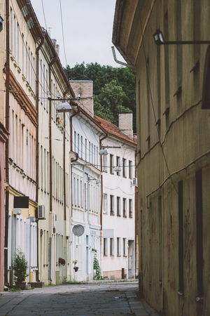 Narrow empty street in old town of Kaunas city, Lithuaniaの写真素材