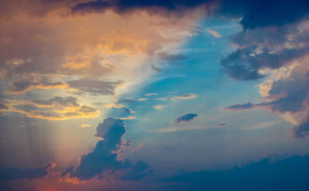 Beautiful and colorful cloudscape with sun rays, natural backgroundの写真素材