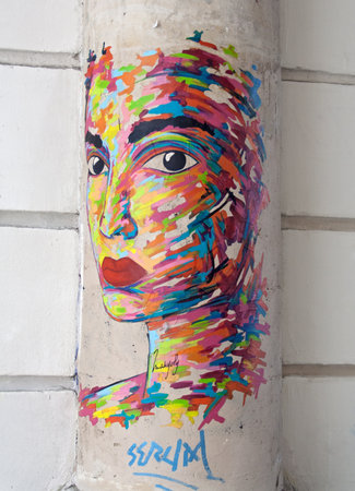 graffiti of a female head on a column in parisのeditorial素材