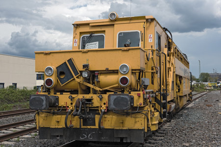 A yellow tamping and straightening machineのeditorial素材