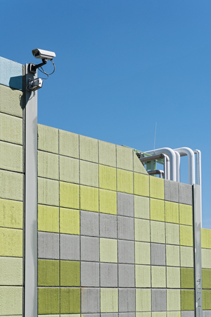 Security camera on a colorful background