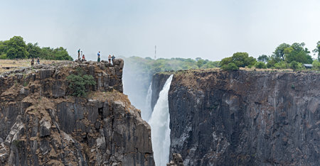Tourists at Victoria Falls, Zimbabwe, Zambia, Africaのeditorial素材