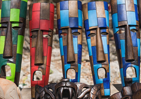Colored wooden masks at a souvenir stand in Chichen Itza, Yucatan, Mexicoのeditorial素材