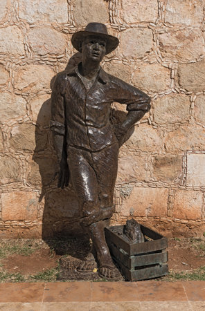 Bronze statue fisherman on the city wall of San Francisco de Campeche, Mexicoのeditorial素材