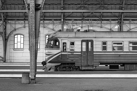 Passenger train at Lemberg-Holovnyi station, the main train station in Lviv, Ukraine, black and...
