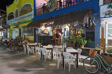tourists in a bar on holbox island, quintana roo, mexico in the north of the yucatan peninsula