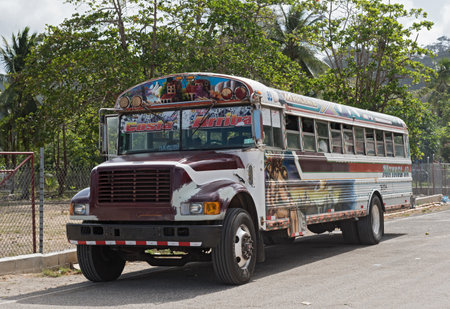 colorful painted chicken bus in puerto lindo panamaのeditorial素材
