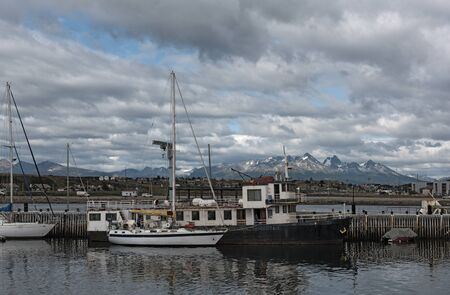 view of the ships and boats in Ushuaia Harbor, Argentinaの写真素材