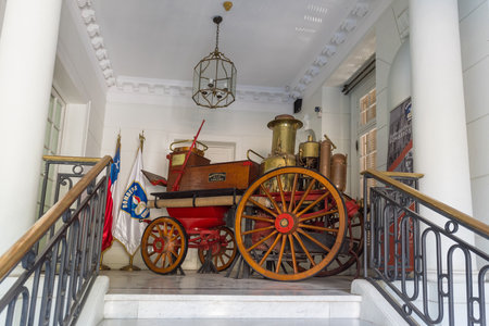 old steam fire truck in front of a fire station in Santiago, Chile