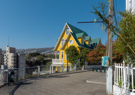 Beautiful traditional yellow wooden building in Valparaiso, Chileのeditorial素材
