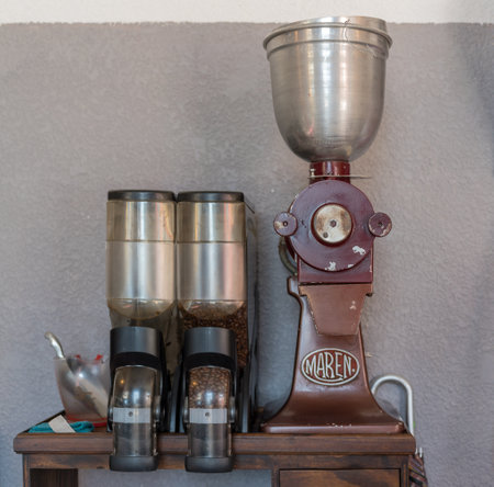 old coffee grinder with coffee beans in closeupのeditorial素材