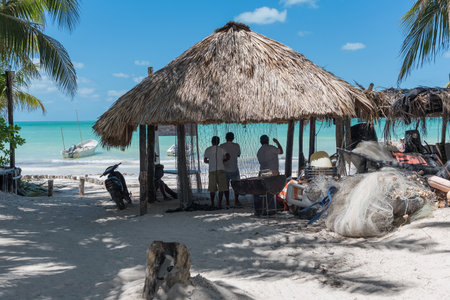 fishermen on the mexican caribbean island holbox hanging up their netsのeditorial素材