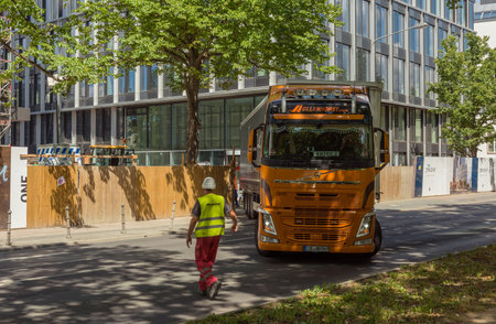 Semi truck driving backwards to a large construction site, Frankfurt, Germanyのeditorial素材